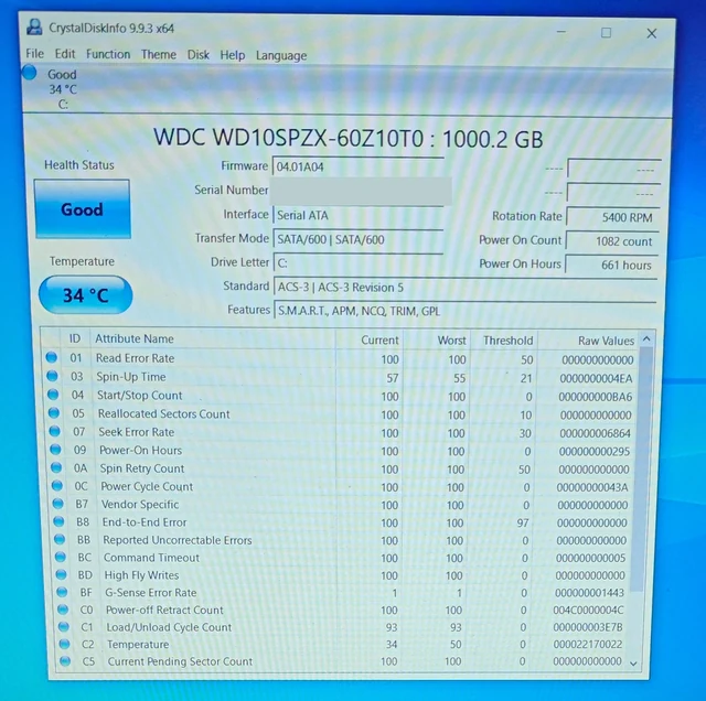 CrystalDiskInfo showing a 1 TB WD hard drive with Good health status, 34 °C, 661 power-on hours and zero reallocated sectors