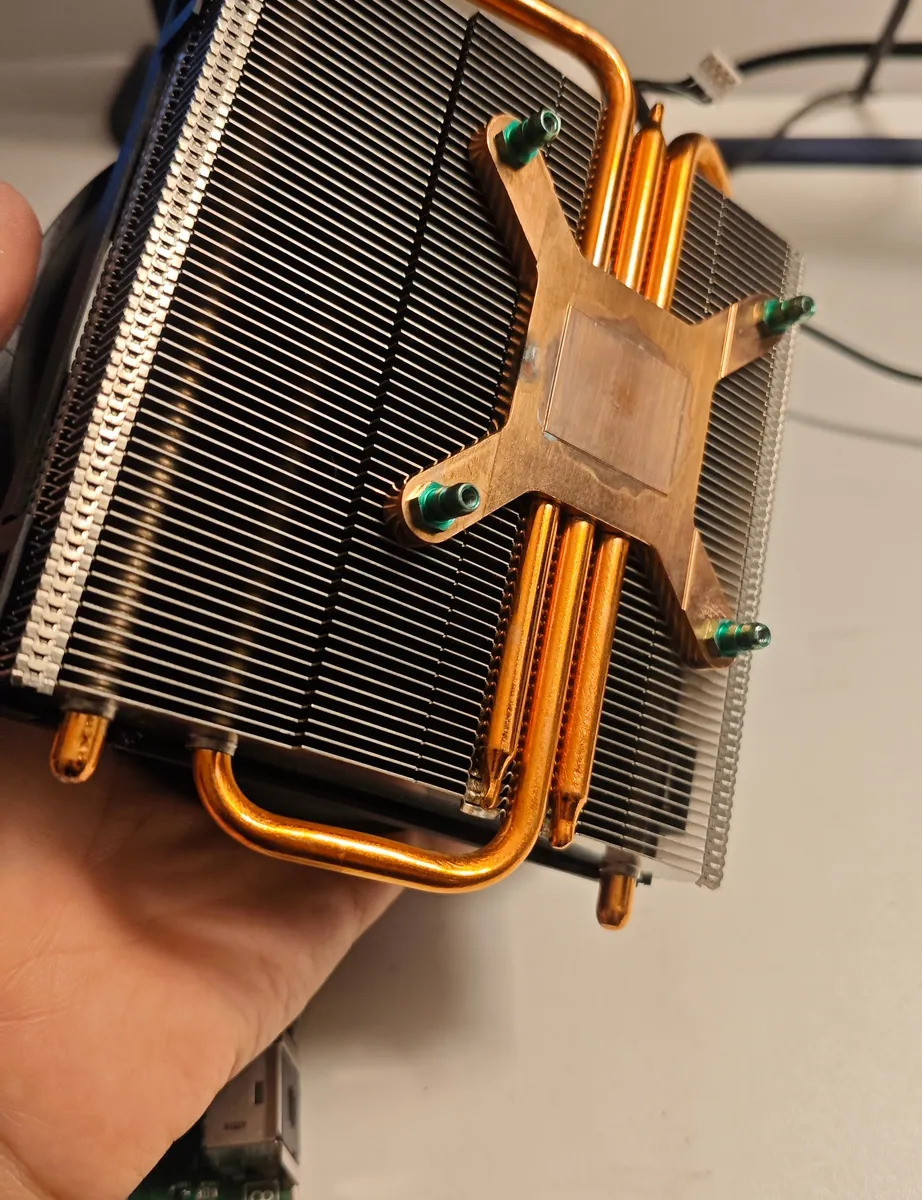 Xbox One heatsink after cleaning, with clear fins and a clean copper base